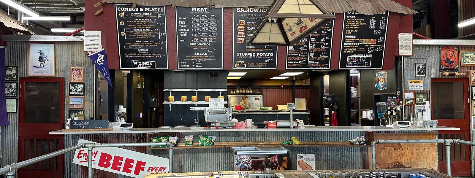 The order counter and menu boards inside Serious Texas Bar-B-Q Loveland